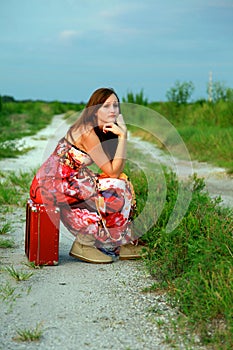 Runaway girl on suitcase