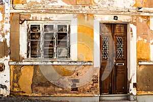 Rundown house with yellow facade