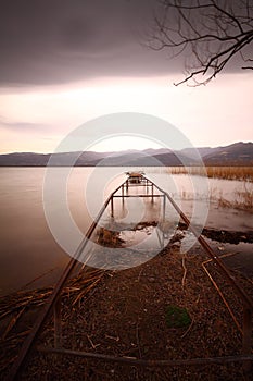 A rundown lakeside pier