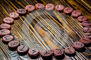 Rune circle on a wooden table, Elder Futhark