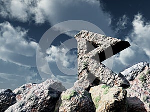 Rune rock under cloudy blue sky