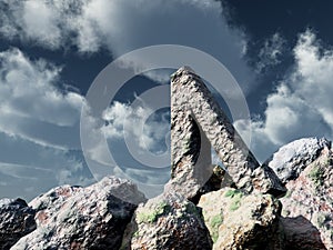 Rune rock under cloudy blue sky