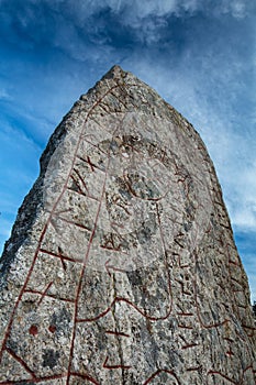 Rune stone and a dramatic sky