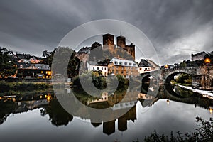 Runkel, a romantic place in Hesse on the Lahn. Real old Stonebridge with dramatic sky. reflection