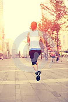 Runner athlete running on city street