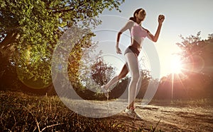 Runner athlete running at park.