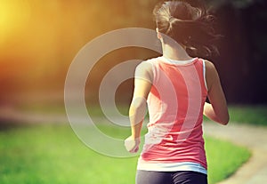 Runner athlete running at park trail