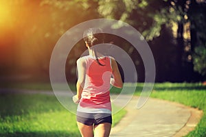 Runner athlete running at park trail