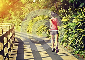 Runner athlete running at park trail