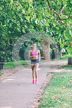 Runner athlete running at park. woman fitness jogging workout wellness concept.