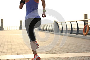 Runner athlete running at seaside