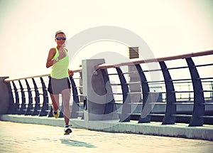 Runner athlete running at seaside