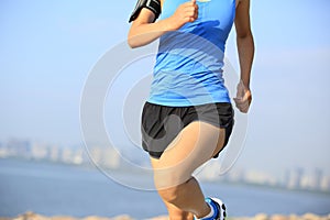 Runner athlete running at seaside city