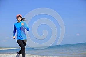 Runner athlete running on seaside of qinghai lake