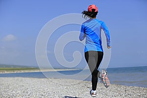 Runner athlete running on seaside of qinghai lake