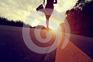 Runner athlete running at seaside road