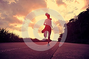 Runner athlete running at seaside road