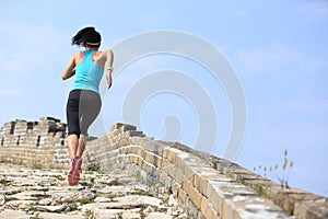 Runner athlete running on trail at chinese great wall