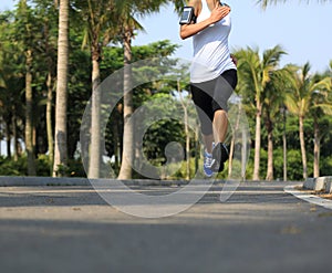 Runner athlete running at tropical park