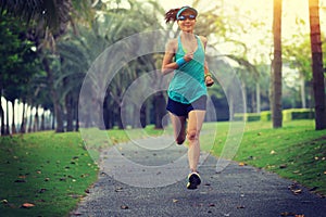 Runner athlete running at tropical park