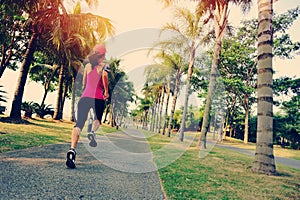 Runner athlete running at tropical park