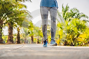 Runner athlete running at tropical park. woman fitness sunrise jogging workout wellness concept