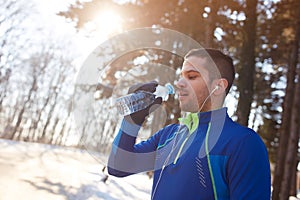 Runner on break with bottle of water