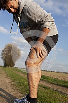 Runner with cramp photo