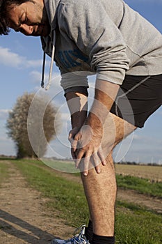 Runner with cramp photo