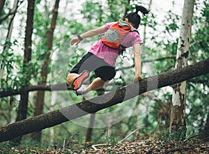 Runner cross country trail running in forest