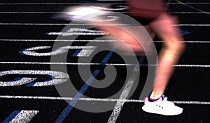 Runner Crossing the Finish Line of a Race on a Track Blurred