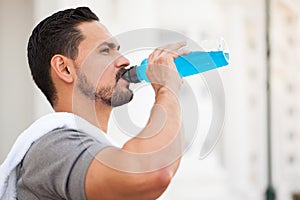 Runner drinking a sports drink