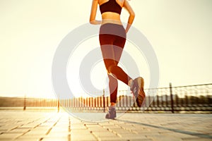 Runner feet running on road closeup on shoe.