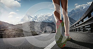 Runner feet running on road