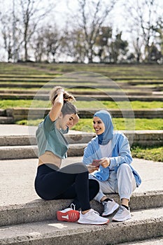 Runner Girls Using Phone