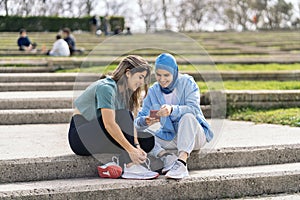 Runner Girls Using Phone