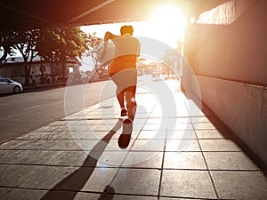 Runner in high speed running action on city run