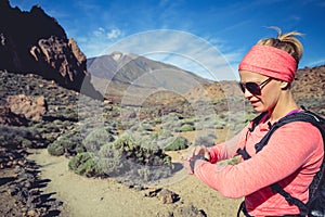 Runner looking at sport watch checking performance