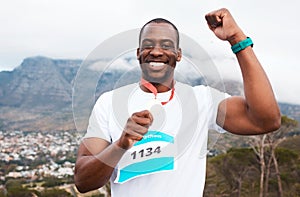Runner man, celebration and medal in portrait for marathon, competition or race with smile in Cape Town. African winner