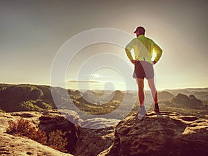 Runner man on rocky road of mountain nature. Male sprinter