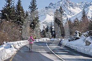 Runner on mountain road in winter. Healthy fitness concept. Fitness workout. Healthy active lifestyle.