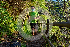 Runner practices trail running in a forest.