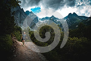 Runner run on Trail in mountains - trail running concept sportovní foto, upravit prostor