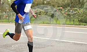 Runner running on city road