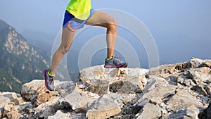 Runner running at great wall on the top of mountain