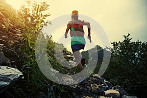runner running at great wall on the top of mountain