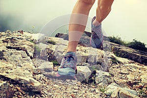 Runner running at great wall on the top of mountain