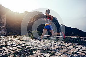 Runner running on mountain top