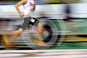 Runner Running a Race on Track with Baton Relay Team Score