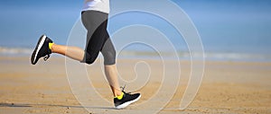 runner running on seaside sandy beach